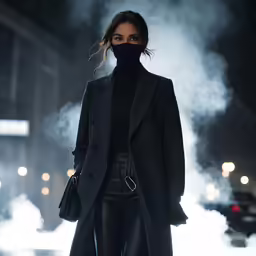 a woman in black leather pants and a dark coat