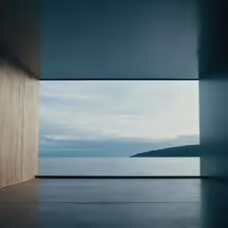 the view from inside an open area with water