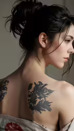 a beautiful young woman with her tattoo done by the photographer