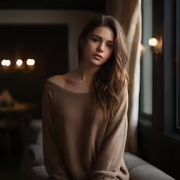 a woman sitting in the corner of a room