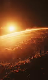 some people walk down a hill at sunset