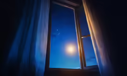 the full moon is shining brightly through the open window