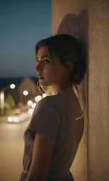 the woman is looking out over her shoulder