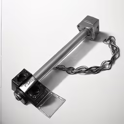 a camera is sitting on top of a metal beam