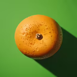 an orange that is sitting on the ground