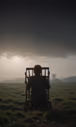 the silhouette of a child sitting in a small toy chair on the ground