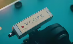 a photo of a camera with a camera strap