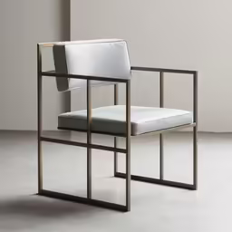 a chair with white leather and gold frame