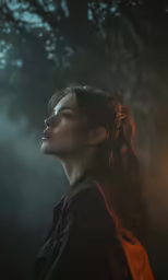 a woman looking to the right with trees in the background