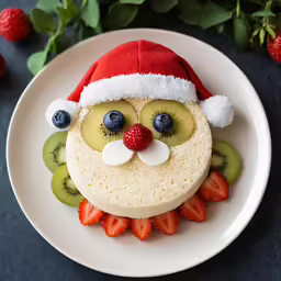 a fruit decorated cake sitting on top of a plate