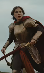a woman in armor holds a sword and a sword