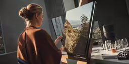 the woman is doing something in her own studio
