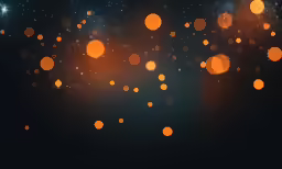 some orange lights are glowing brightly against a dark background