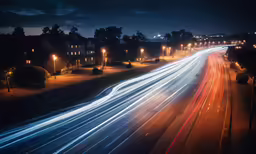 a photograph of an intersection taken from the top floor of an apartment building