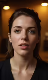 a woman looking into the distance while she is not wearing makeup