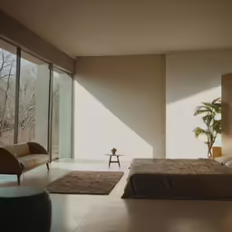 the room has some chairs and bed in it