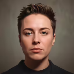 a close up of a person with a hair style