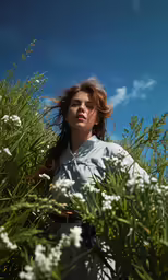 there is a woman that is walking in a field