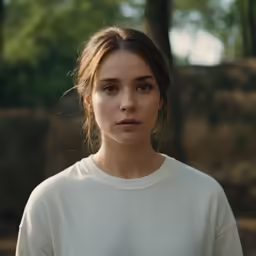 a close up shot of a girl looking into the camera