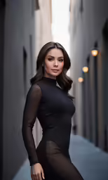 an attractive woman posing in an alley way