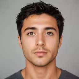 the young man is posing for the camera