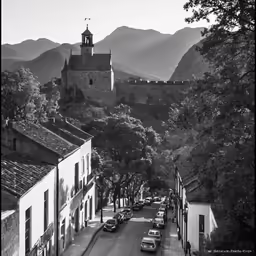 the hills are dotted with buildings and a tower
