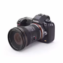 a camera on a white background with its lens on the bottom