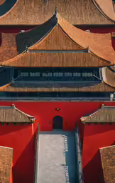 a red building that has brown roofs on it