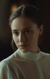 the young woman is wearing a white shirt