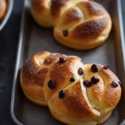 bread with cranberries on top in a pan