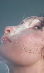 the beautiful young girl has frecky spots on her face