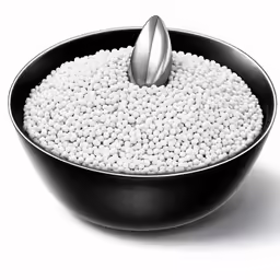 a metal spoon on top of a bowl of food