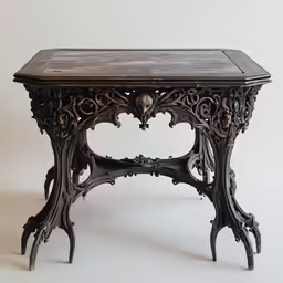antique wood table, with intricate carved decoration