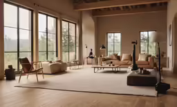 an open living room with a lot of windows