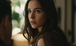 a woman looking at another man in the other direction