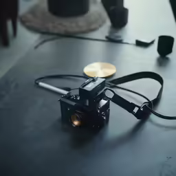 the small digital camera is set up on a table